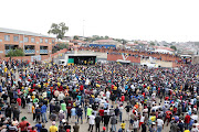 Residents of Alexandra wait to be addressed by President Cyril Ramaphosa