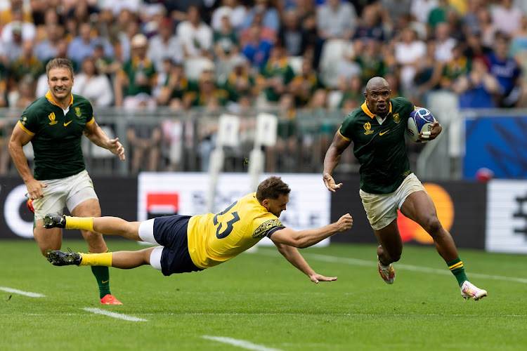 Springbok hat-trick scorer Makazole Mapimpi breaks through the tackle of Gabriel Pop of Romania to run through for one of his tries in the 2023 Rugby World Cup pool B match at Nouveau Stade de Bordeaux on Sunday.