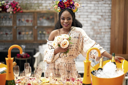 Nomzamo Mbatha at Ludwig's Roses, where the salmon apricot rose was named after her.