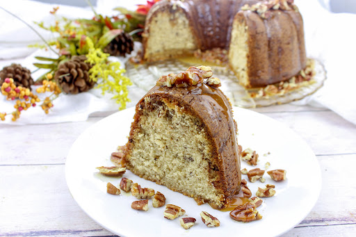 A slice of toffee and brown sugar pound cake on a plate.