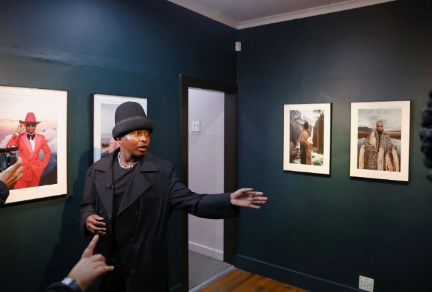 Trevor Stuurman, an award winning contemporary multimedia visual artist, gestures during the opening of his art exhibition titled "A Place Called Home" in Parktown, a suburb of Johannesburg, South Africa, May 19, 2022. Picture taken May 19,2022.