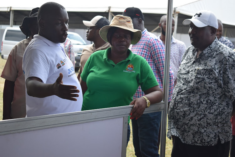 Homa Bay director for environment Roy Odongo explains to Governor Gladys Wanga the preparation level for the investment conference at Tom Mboya grounds in Homa Bay town on February 25,2024