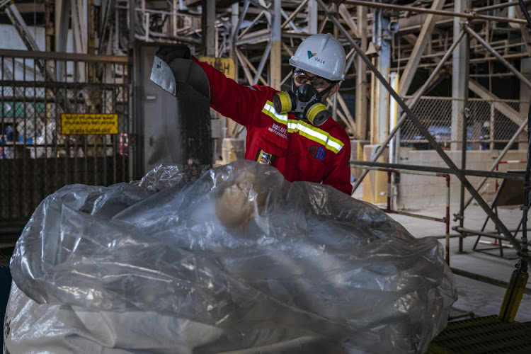 A worker checks nickel quality at a nickel processing plant in Sorowako, South Sulawesi, Indonesia, July 28 2023. Picture: ULET IFANSASTI/GETTY IMAGES