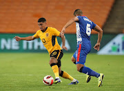 Keagan Dolly of Kaizer Chiefs is challenged by Travis Graham of Maritzburg United in the DStv Premiership match at FNB Stadium in Johannesburg on December 22, 2021.