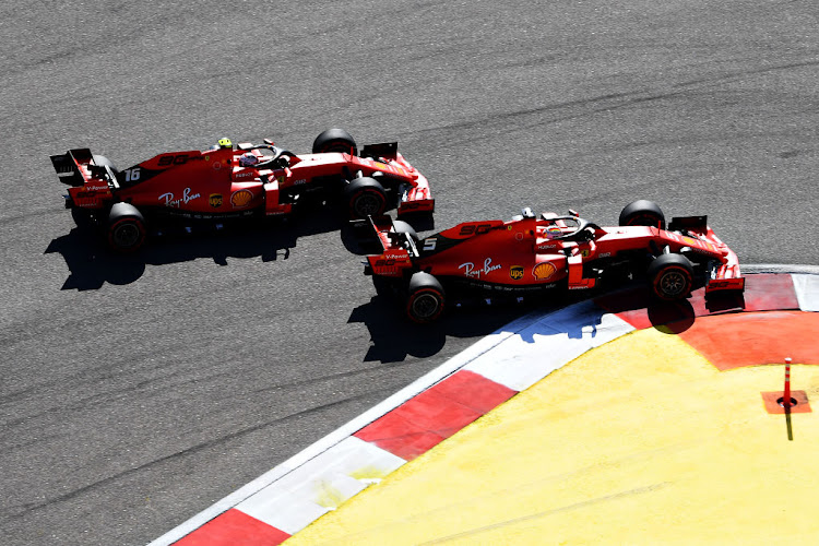 Sebastian Vettel of Germany driving the Scuderia Ferrari SF90 (5) and Charles Leclerc of Monaco driving the Scuderia Ferrari SF90 (16) battle for position at the start of the recent F1 Grand Prix in Russia. The team's former technical director says the balance between the two drivers 'needs careful handling'.