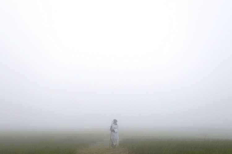 A blanket of thick mist covered the Nhlangakazi mountain in Ndwendwe as Ekuphakameni Nazareth Baptist Church trekked up the mountain for their annual holy pilgrimage. Photo: SANDILE NDLOVU