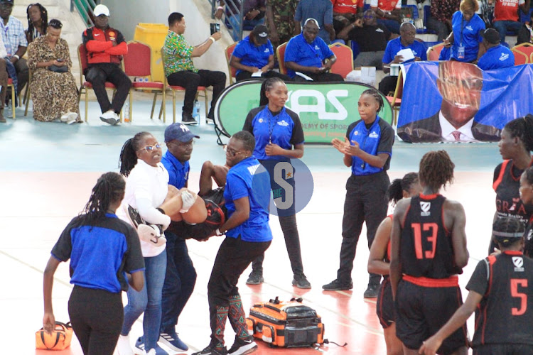Zetech Spaks player is carried off-court after sustaining a knee injury during their final match against KPA at Ulinzi Sports Complex on May 12, 2024.
