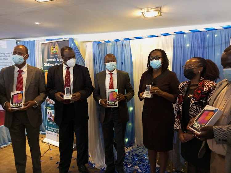 Ag Diretor of Preventive and Promotive Health Services at the Health Ministry Dr Andrew Mulwa and other partners launch the Tools for Integrated Management of Childhood Illness (TIMCI) project at a Nairobi Hotel on November 9, 2021