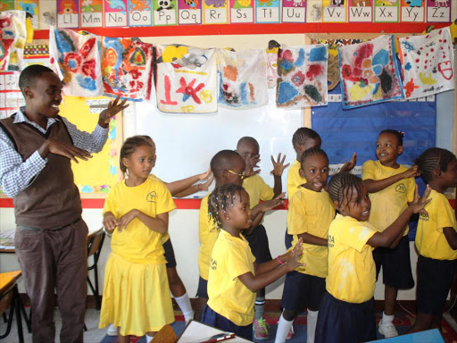 Pupils singing during a class at the Kencada School. /FILE