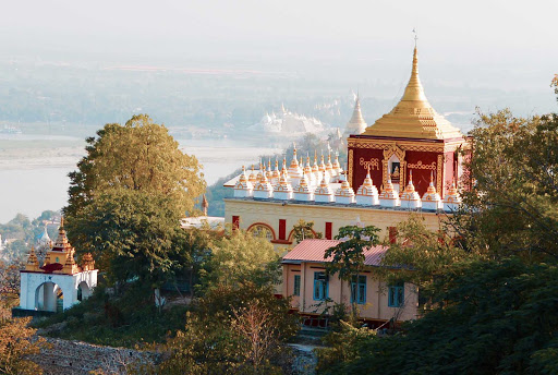 pagoda-in-hillside - One of hundreds of temple complexes along the Ayeyarwady River.