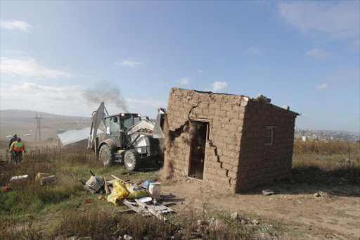 About 300 houses at Masizitha informal settlement were bulldozed today by the King Sabata Dalindyebo Municipality to give way for housing development. Picture: LULAMILE FENI