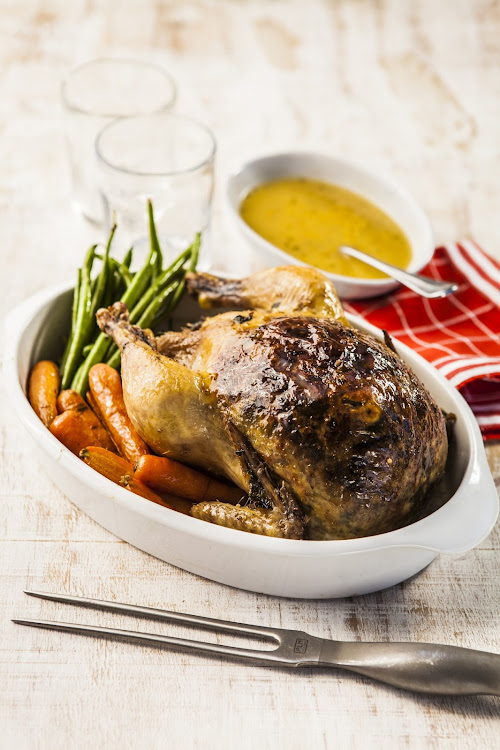 French-style stuffed roast chicken with gravy.