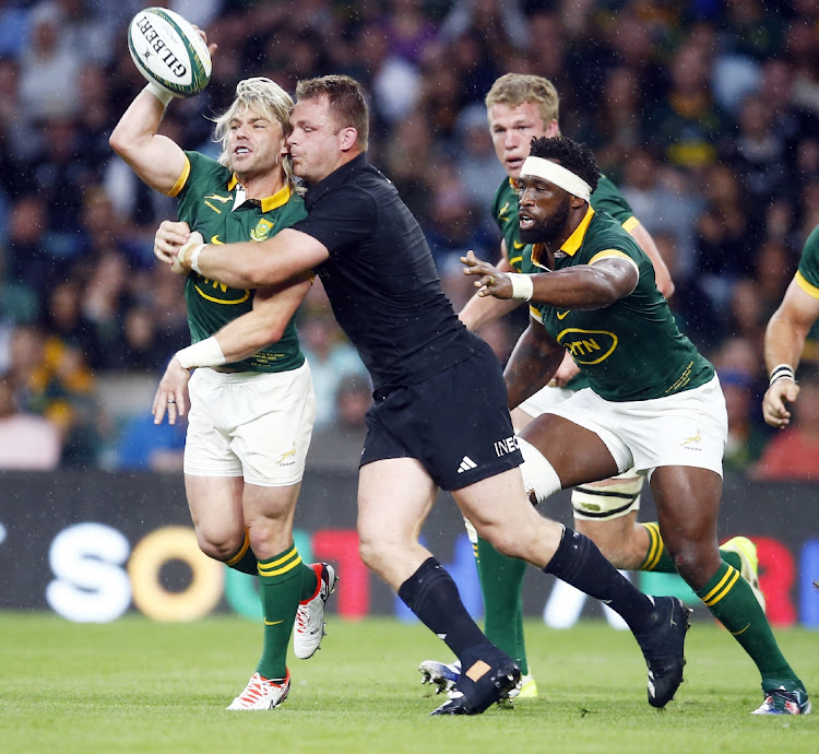 New Zealand captain Sam Cane tackling South Africa's Faf de Klerk during a Rugby World Cup 2023 warm up match in August