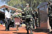 FALLEN HERO: Limpho Hani, the wife of murdered MK commander  and general secretary of the SACP Chris Hani, lays a  wreath at his grave during the  19th anniversary commemoration of his  death.  PHOTO:  Tsheko Kabasia