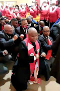 Members of the Methodist church of Southern Africa in Zwelitsha dancing without masks.

