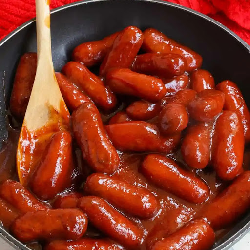 This little Smokies Recipe with little smoked sausages in a slightly spicy barbecue glaze is easily made in the crock pot, on the stovetop, or in the oven. 