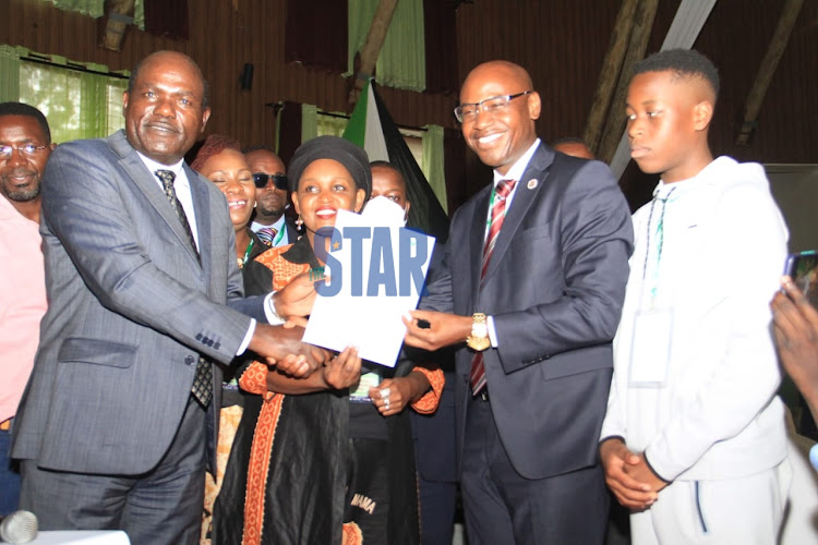 IEBC chairperson Wafula Chebukati presenting presidential candidate Walter Mong'are with the final nomination certificate at Bomas on May,30th.2022