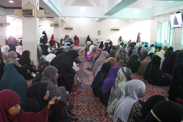 Muslim women sitted as they wait to start prayers to mark the end of the holy fasting month of Ramadhan at Jamia mosque, Nairobi on April 10, 2024