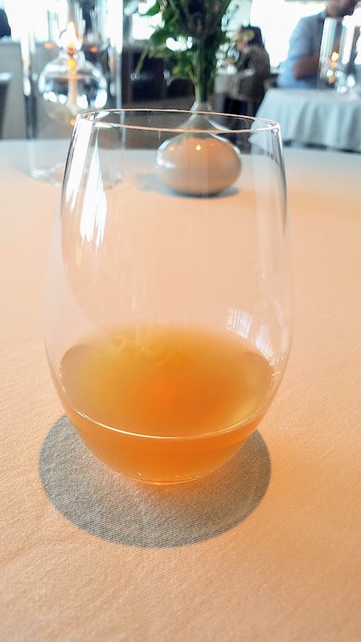 Apple, Jerusalem Artichoke, and Oolong Tea juice pairing at Geranium, a three Michelin star restaurant in Copenhagen