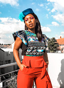 Nokubonga Thusi, Sunday Times Lifestyle's beauty editor wearing Studio Lennie, Rich Mnisi and Kenzo.