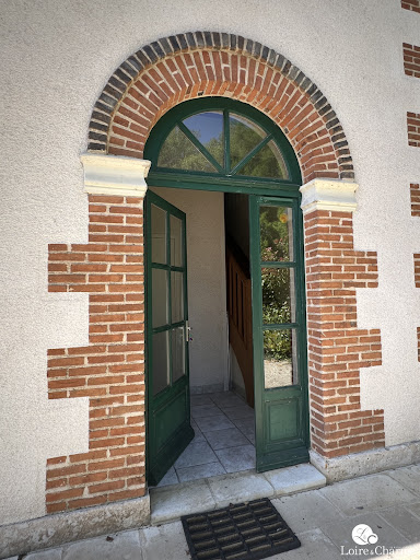 Green front door brick archway in this luxury property for sale in Le Controis-en-Sologne ($365,906 - 130 m²)