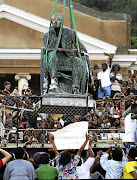 The Cecil John Rhodes statue is removed from the University of Cape Town in 2015. The event was symbolic of a wider goal of decolonisation in tertiary education.