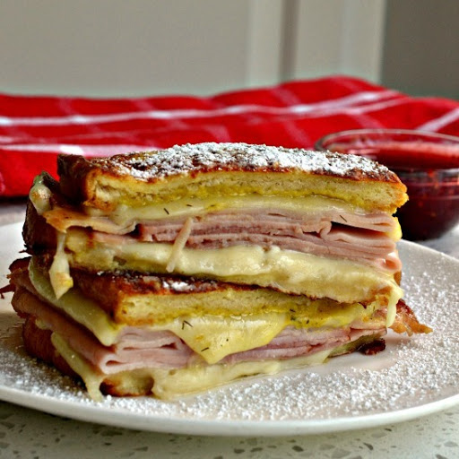The bread on this easy to make delectable ham, turkey and Swiss Cheese sandwich is dunked in an egg mixture and the whole thing is pan fried to golden perfection.