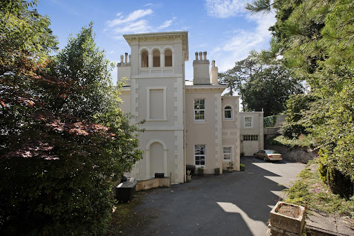 Victorian house facade surrounded by trees in this luxury house for sale in Torquay ($1,670,687)