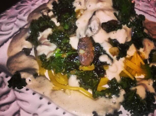 Braised KALE over Quinoa Pasta with a Garlic Alfredo Sauce made from Cashews. Healthy & Delicious! 