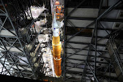 NASA's next-generation moon rocket, the Space Launch System (SLS) rocket with its Orion crew capsule perched on top, is seen in the Vehicle Assembly Building (VAB) before it is scheduled to make a slow-motion journey to its launch pad at Cape Canaveral, Florida, US March 16, 2022. 