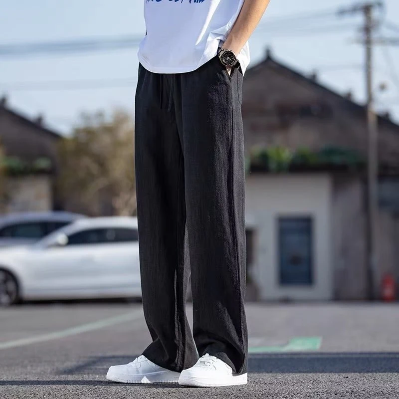 Men's Japanese-Style Retro Linen Baggy Straight Trousers offer a comfortable, breathable, and relaxed fit. Perfect for a