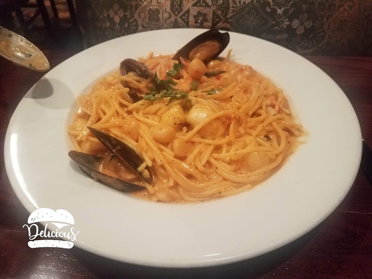 The gluten free seafood pasta in pink sauce. There were lots and lots of scallops, plenty of shrimp as well as some freshly cooked clams and oysters in their shells.  The sauce flavor was very tasty!