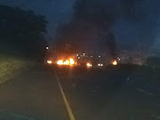 Angry residents of Cornubia blockaded a busy highway with burning tyres after two children were knocked over while crossing the road.