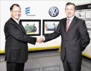 DIESEL DEAL: Volkswagen of South Africa Managing Director David Powels (right) with Eberspächer South Africa's managing director Henry Eksteen. Pictured behind them are graphic representations of a diesel particulate filter (DPF). © Unknown.