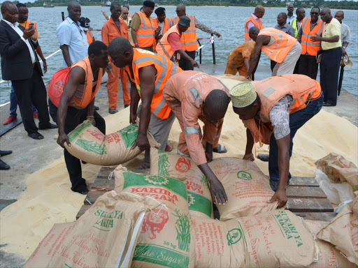 Kenya Ports Authority employees begin the destruction of 400 tonnes of imported contraband sugar at Port of Mombasa's G section, May 13, 2018. /JOHN CHESOLI