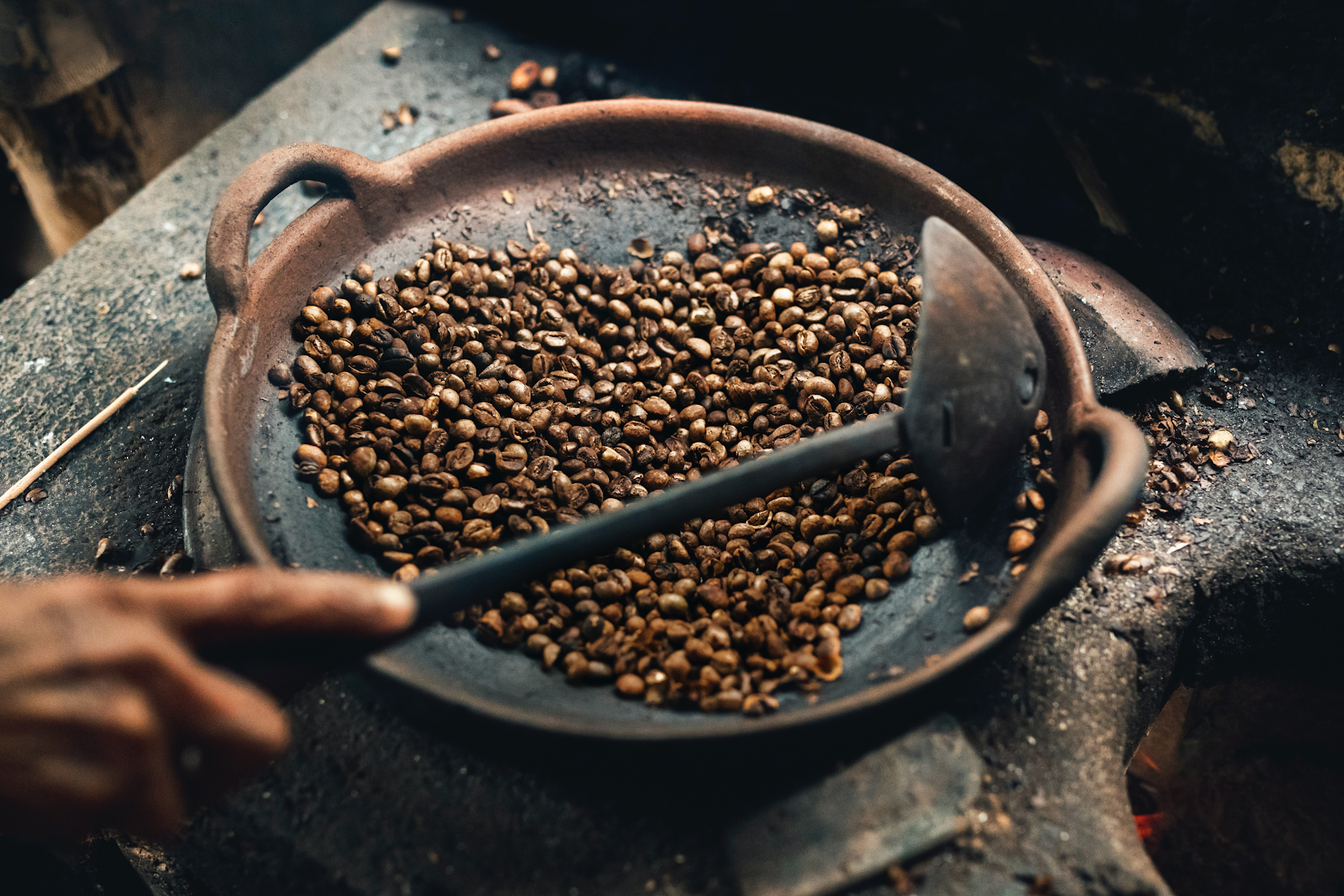 coffee beans roasting on stovetop