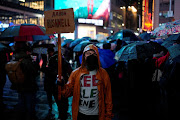 A person holds a placard at a vigil and protest held outside a U.S. military recruiting center for U.S. Airman Aaron Bushnell, who died after setting himself on fire in front of the Israeli Embassy in Washington on February 25 in an apparent act of protest against the war in Gaza between Israel and the Palestinian Islamist group Hamas,