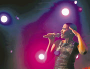 Zonke Dikana, seen here performing at the Cape Town Jazz Festival, says she's good at saving but also likes to live well