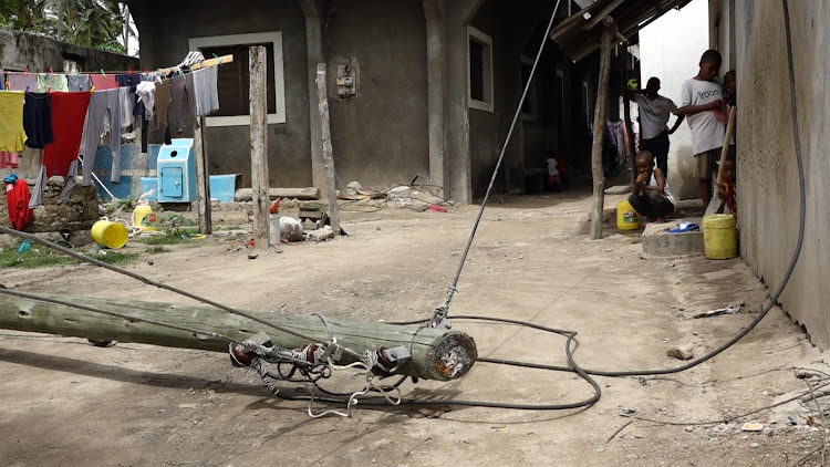 A fallen electricity pole which has live wires at Watamu village