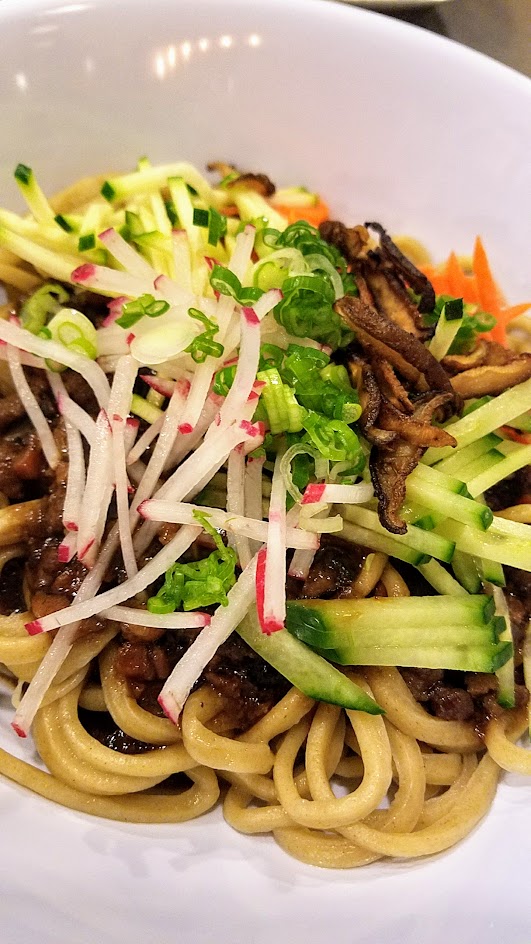 Danwei Canting noodle dish of Chongqing Liang Mian with thin chilled egg noodles with shredded chicken, sesasme paste, radish and spicy Chonqing sauce