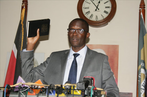 New Secretary and Chief Executive Officer of IEBC Ezra Chiloba takes the oath of office at the Supreme court on Tuesday,February 03. Photo/COLLINS KWEYU