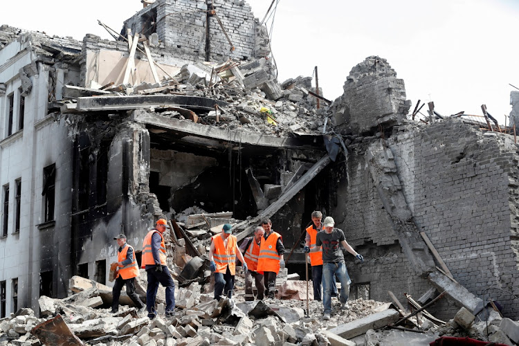 Emergency management specialists and volunteers remove the debris of a theatre building destroyed in the course of Ukraine-Russia conflict in the southern port city of Mariupol, Ukraine on April 25, 2022. File Picture: REUTERS/ALEXANDER ERMOCHENKO