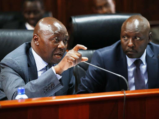 Energy PS Njoroge Kamau (L) with Kenya Power MD Ken Tarus when they appeared before Senate Energy Committee on the high cost of electricity in the country. May 3, 2018. Photo/Jack Owuor