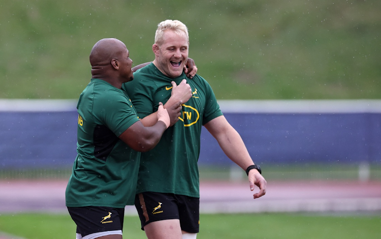 Springboks hooker Bongi Mbonambi (left) jokes with teammate Vincent Koch during a training session before their Rugby World Cup 2023 final against New Zealand at Stade des Fauvettes on October 23 in Domont, France.