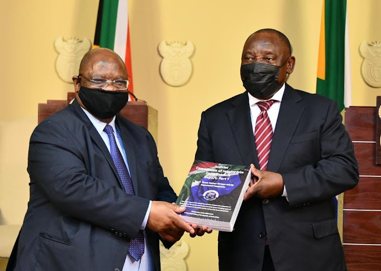 President Cyril Ramaphosa receives the first part of the state capture commission's report from acting chief justice Raymond Zondo on Tuesday.