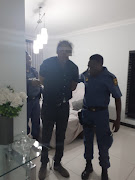 Esmael Malude Ramos Nangy (black shirt), who is an alleged kingpin wanted for kidnapping cases in Mozambique, was arrested in Centurion on Saturday.