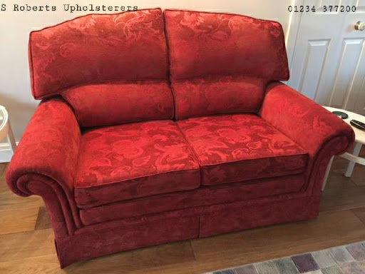 A before and after of one of two red two seater settees with frames by Steed Upholstery?. Re-upholstered in a grey/blue/cream plaid from Blendworth Furnishings? by Pauland Jake for a customer in Emsworth.  