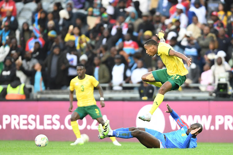 Mihlali Mayambela of South Africa and Ikoko Jordan of DR Congo during the international friendly match between South Africa and DR Congo at Orlando Stadium on September 12, 2023 in Johannesburg, South Africa.