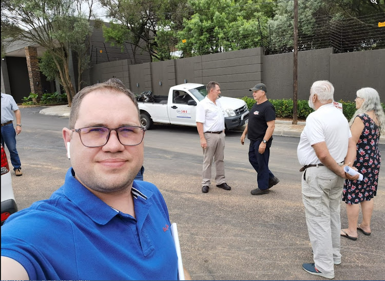 Ward 134 councillor Devon Steenkamp engages with the community and Johannesburg Roads Agency engineers on concerns about a developer who made changes to a portion of Honeydew Road West in Sundowner believed to pose an increased accident risk.