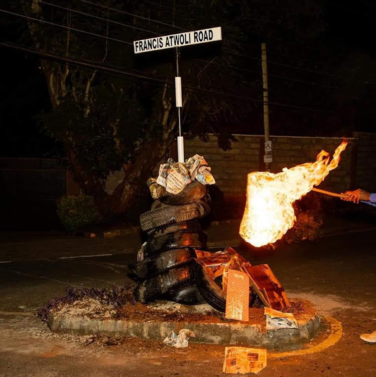 Unknown individual setting fire on Francis Atwoli Road signpost.